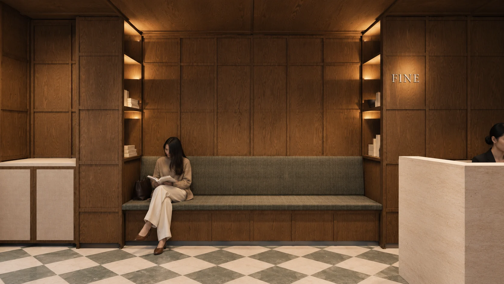 FINE Clinic reception with a pale stone desk, an olive waiting bench and oak panelling across the walls and ceiling.